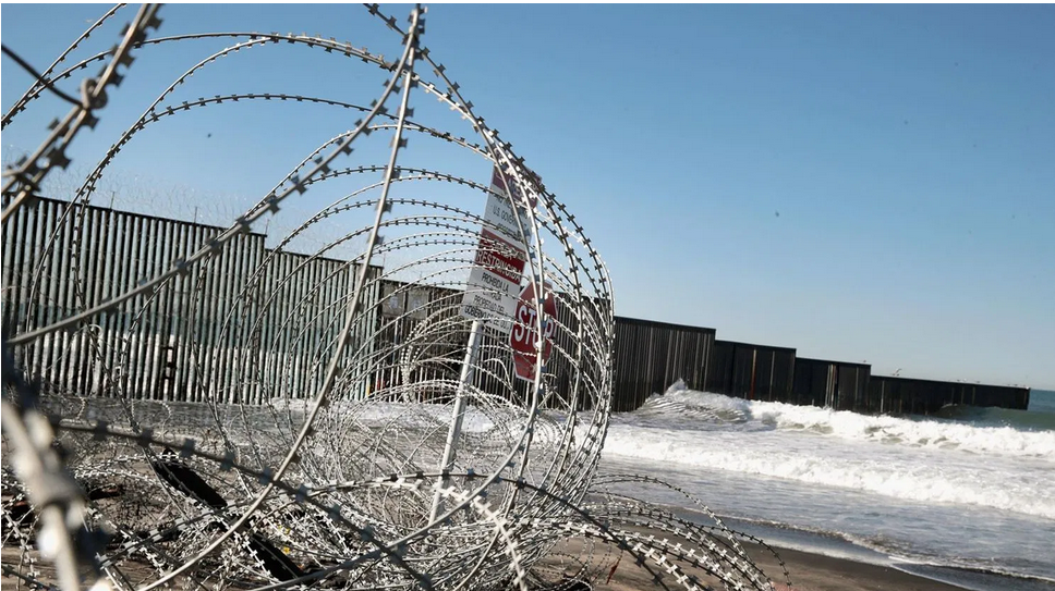 Concertina wire provides a secondary barrier between the U.S. and Mexico where the border between the two countries meets the Pacific Ocean at Border Field State Park on January 23, 2019 in San Diego, California. (Photo by Scott Olson/Getty Images)